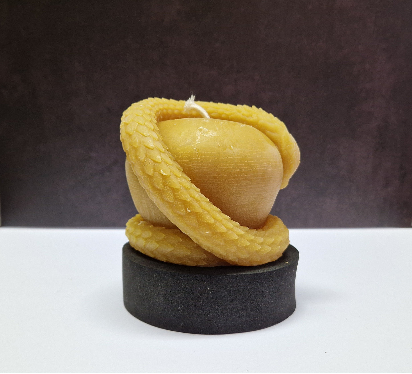 Kerze Schlange auf Apfel